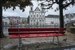 Red bench and Jesuit church.